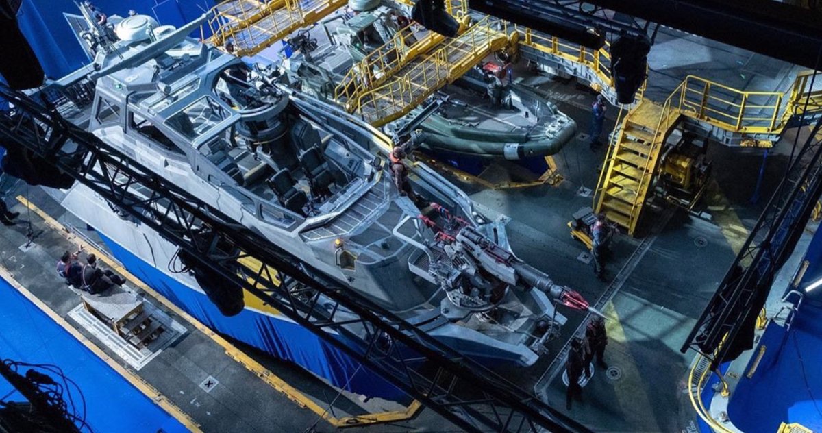 Large boat film set under construction inside a studio